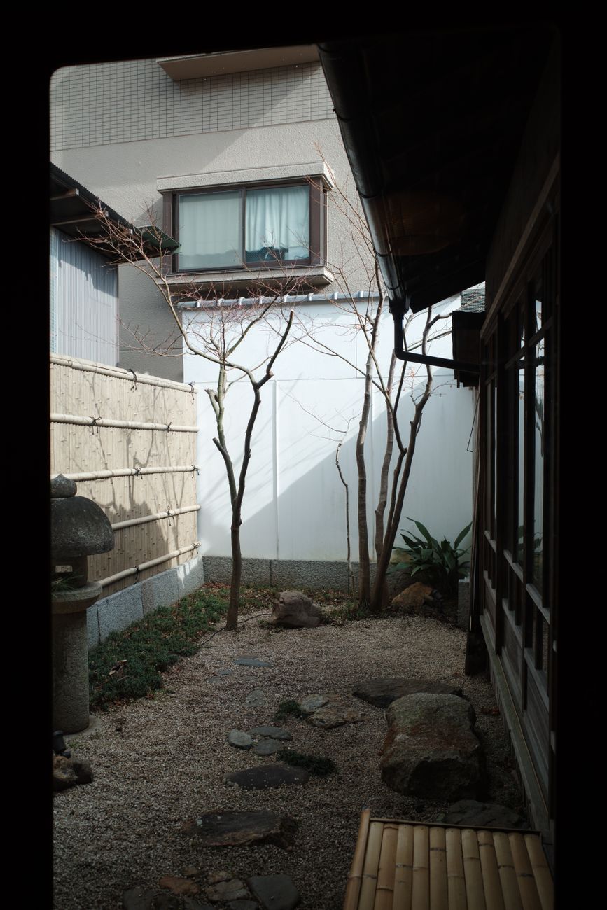 Peaceful Kyoto garden courtyard with stone lantern